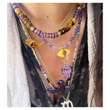 Collar con cuentas de amatista y ojo de tigre de Greta